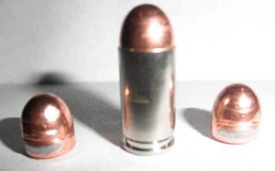 Photo of damaged bullets and crease in case of good round